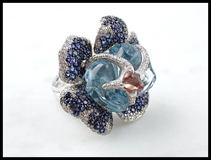 Flower Theme Ring in 18K White Gold with Diamonds, Blue Sapphires, Orange Sapphire and Uncut Aquamarine