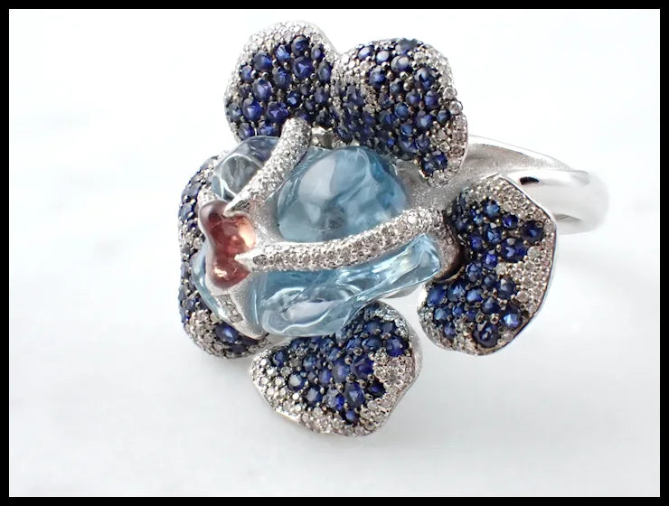 Flower Theme Ring in 18K White Gold with Diamonds, Blue Sapphires, Orange Sapphire and Uncut Aquamarine